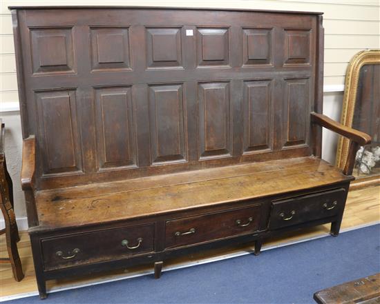 A George III fruitwood settle with drawers below, W.193cm